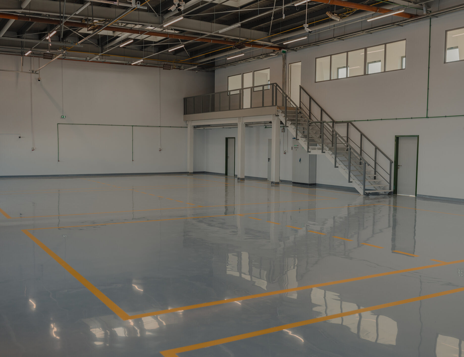 Epoxy and waxed flooring with colorful signage in car service